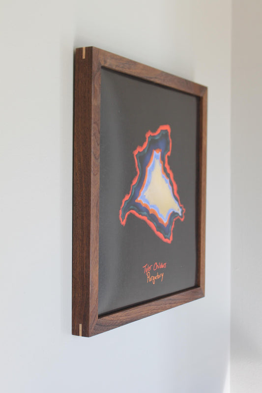 a picture hanging on a wall in a room